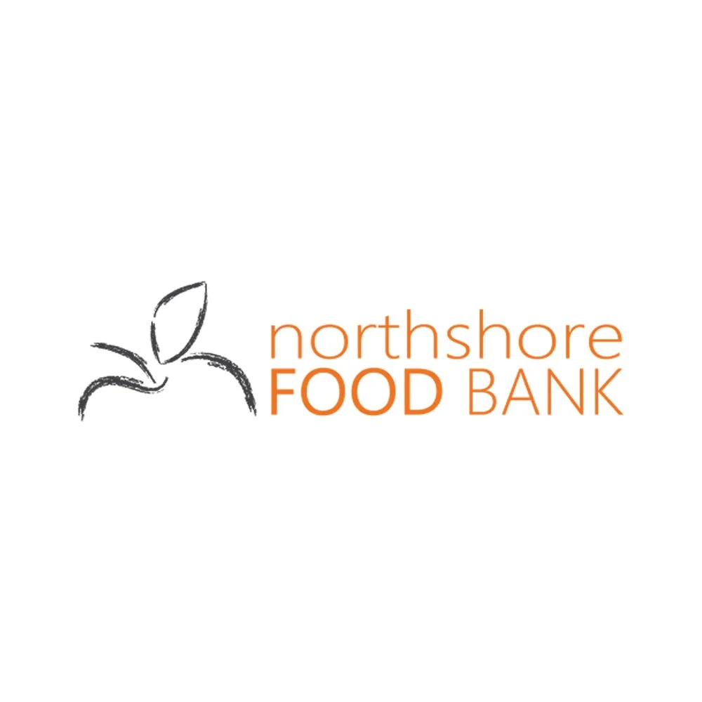 Logo of Northshore Food Bank featuring a simple black outline of an apple with a leaf, and the words 'northshore FOOD BANK' in orange text.