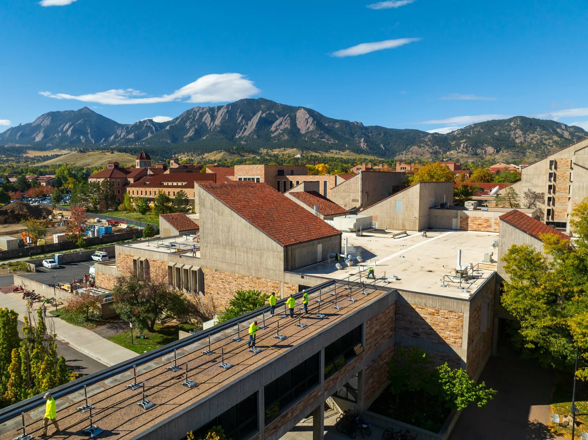 Kindry Construction crew installing rooftop fall protection at the University of Colorado Boulder