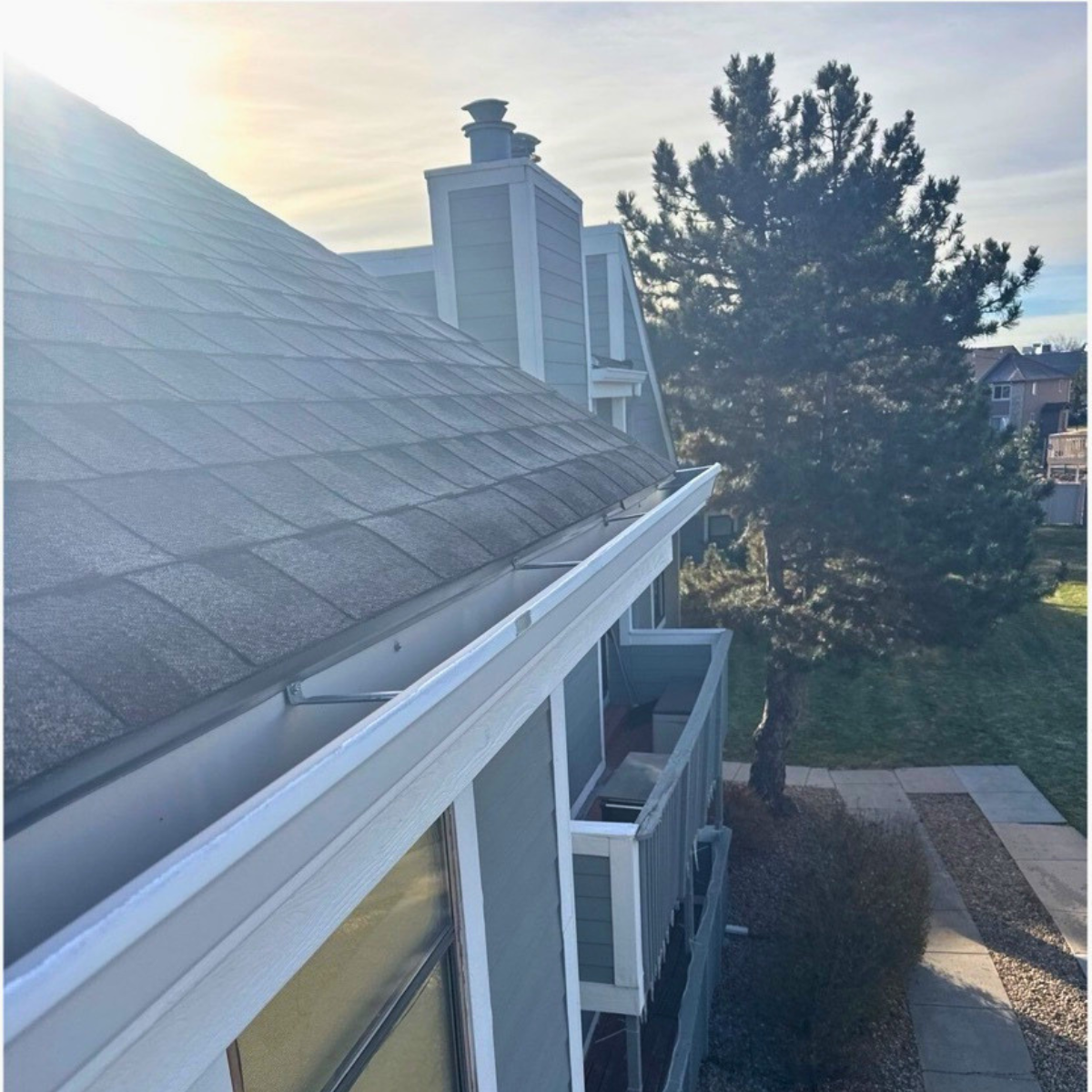 Multi-family HOA property in Denver Colorado showing roofline and gutter system for proper drainage and maintenance
