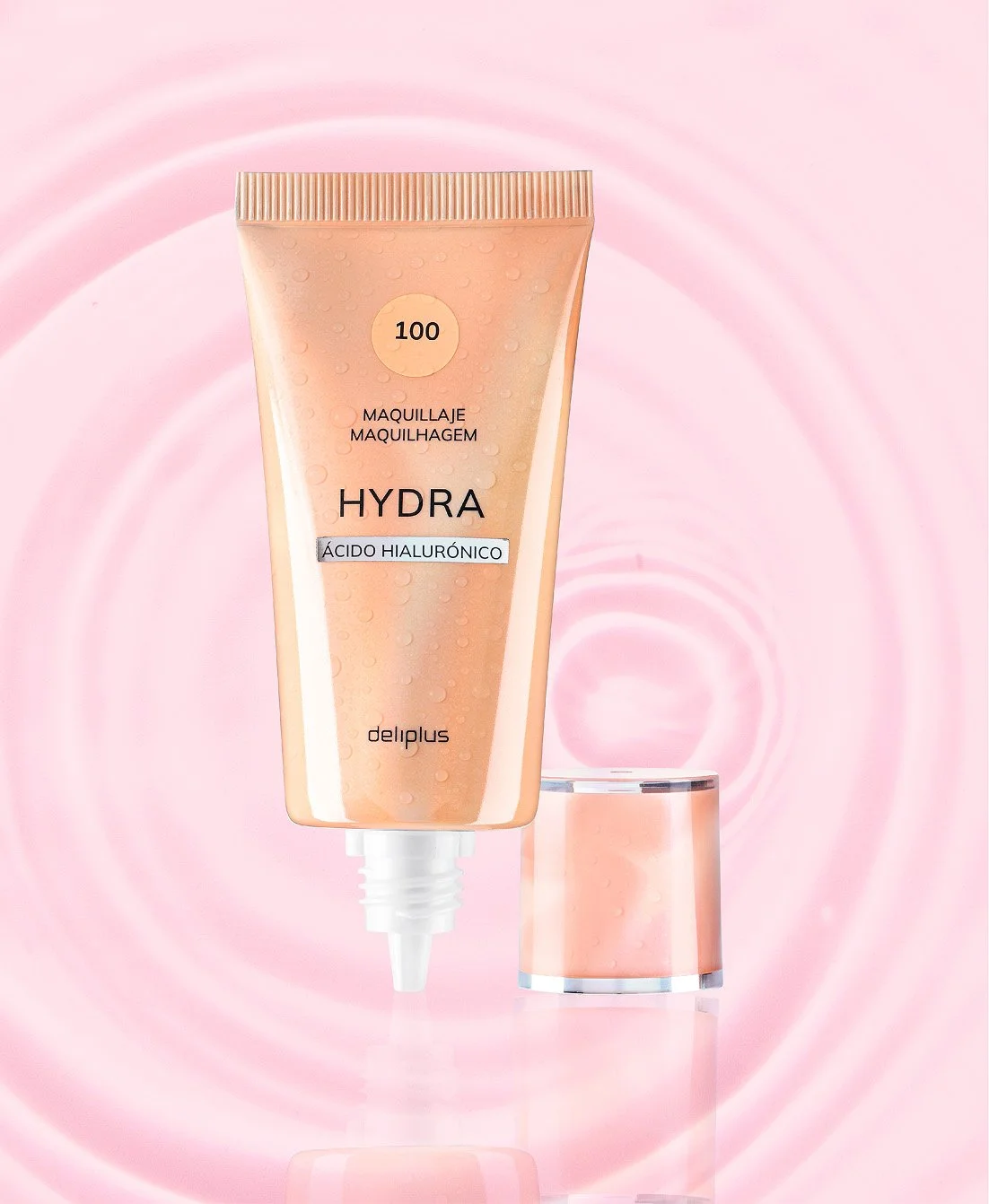 Tubo de crema facial hidratante con ácido hialurónico, fondo rosa con ondas, envase transparente con tapa, y texto en español_línia bàsica de Deliplus_mercadona_diseño de packaging de cosmètica de estudio berlin