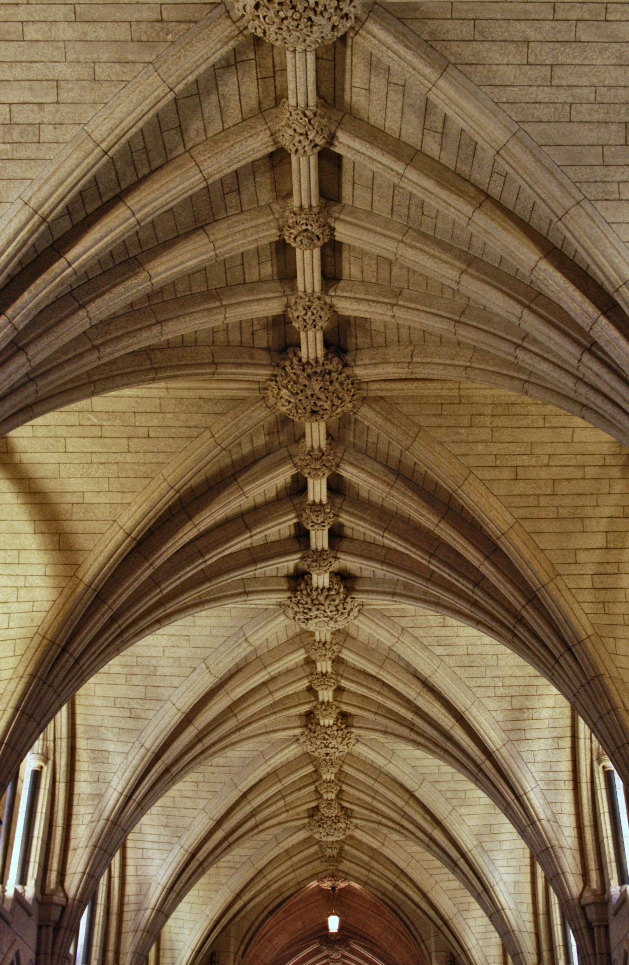 Interior view of Gothic-style stone vaulted ceiling with ribbed arches and decorative bosses.