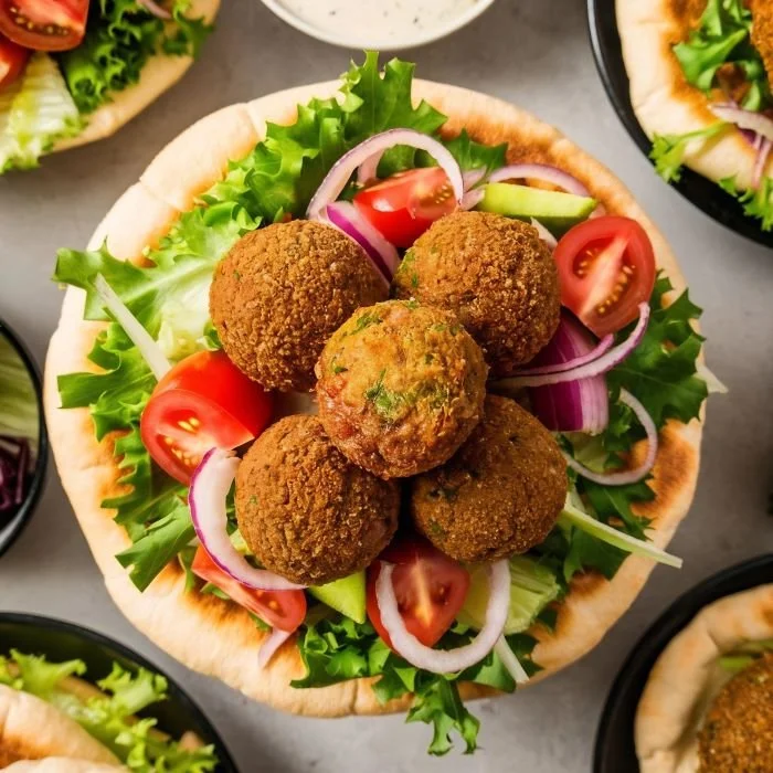 top-view-falafel-with-fresh-vegetables-table.jpg