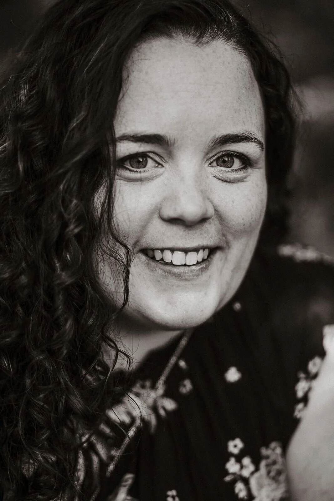 A black and white photo of Camille, the founder of Loud&Clear