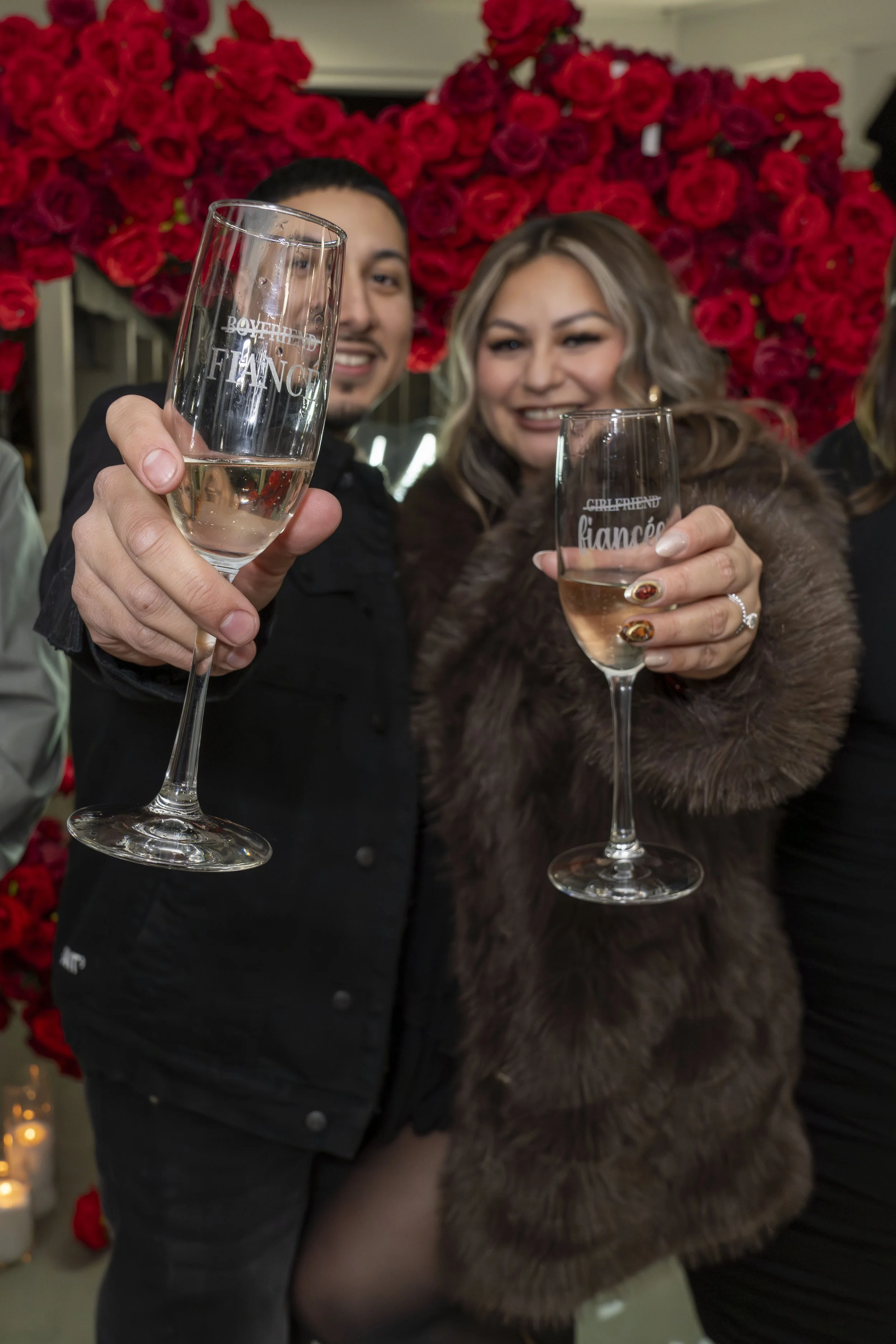 A couple toasting to their engagement.