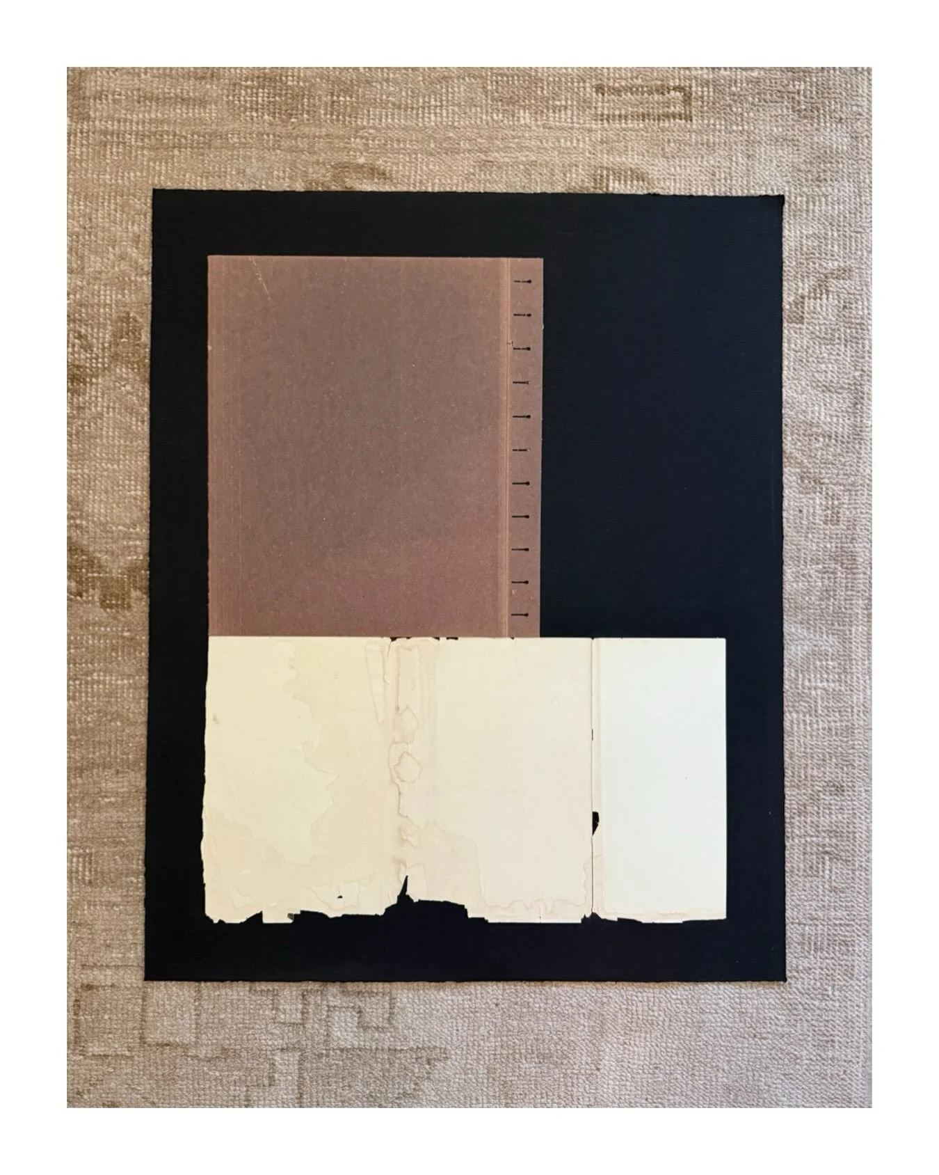 "What We Keep." Structure becomes its own language here&mdash;simple blocks of black, ivory, and timeworn brown, held together by line, edge, and proportion.

The worn folder recalls something once handled and kept. Reassembled, these humbl