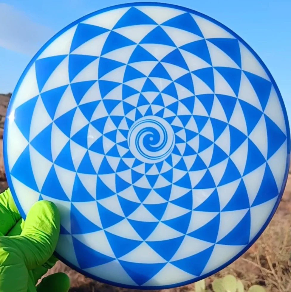 Dynamic Discs Lucid Judge Penny Flower Spiral front.jpg