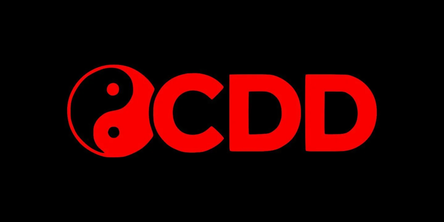 Custom Dyed Discs official logo is A black background with a red yin-yang symbol and the bold red text 'CDD'