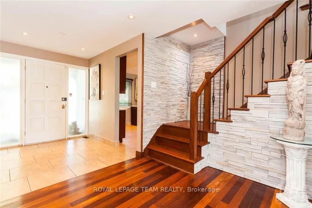 Rembrandt Staircase remodel.  Originally carpeted with wrought iron railing.  Ask about cultured stone as your backdrop!