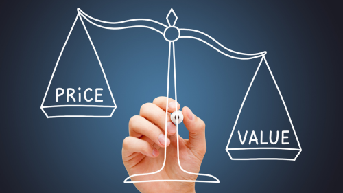 Hand drawing a scale balancing 'Price' and 'Value' on a transparent board.