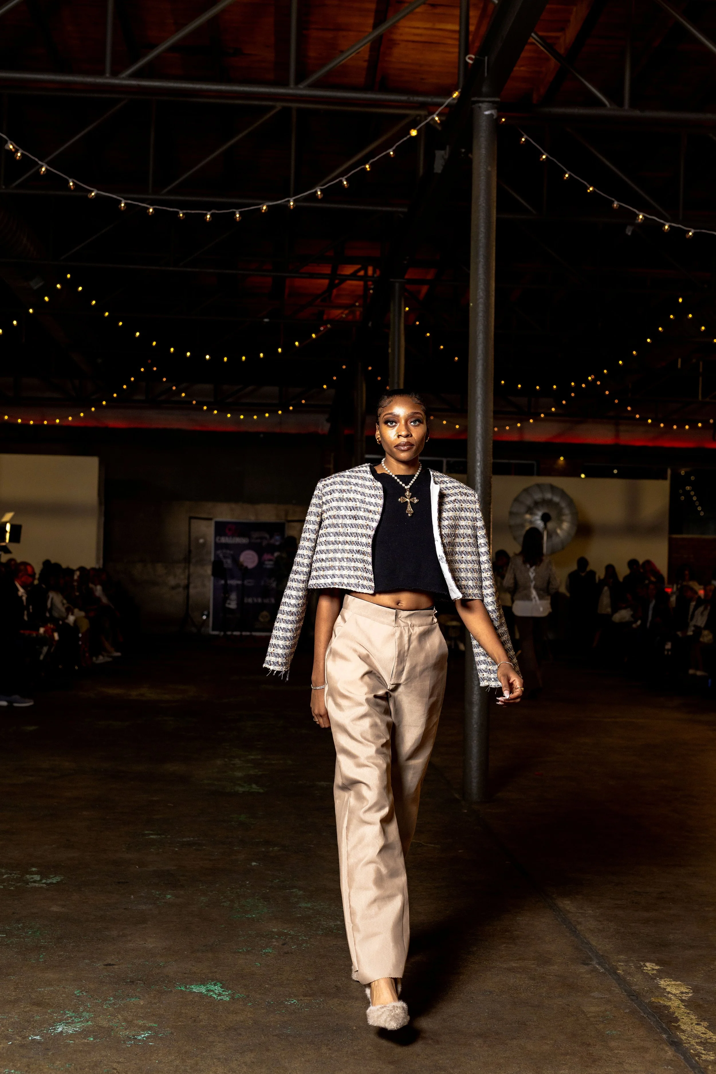 As THE ELEGANCE, puts Elegance too the street on the 2025 Petals and Pavement runway. she is displaying GUARANT3ED's new SYSTEMATIC ANARCHY Collection.