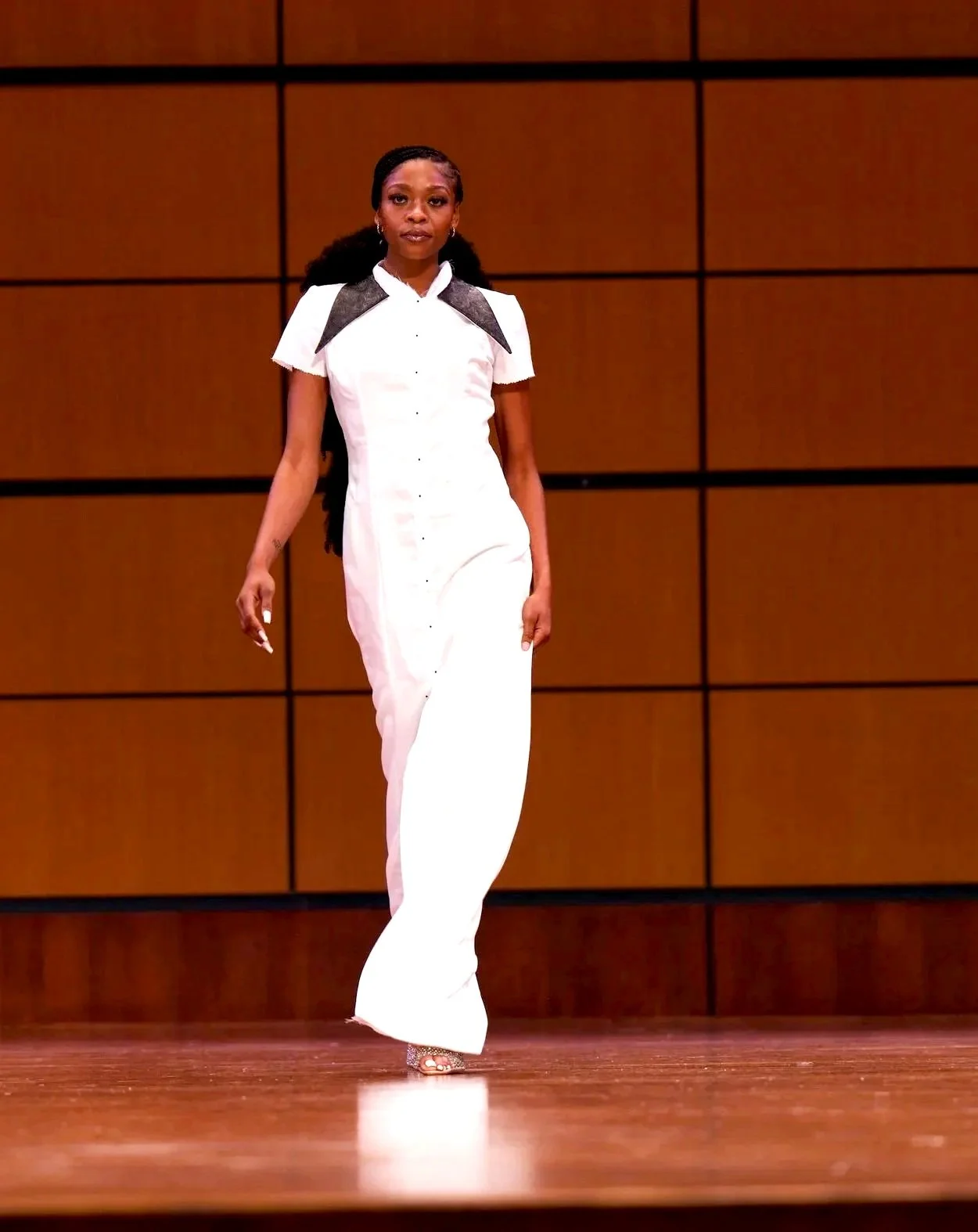 As the Elegance moves gracefully across the stage at Dallas Emerald fashion week 2025! She is sporting a piece from Guarant3ed's ROOTS collection.