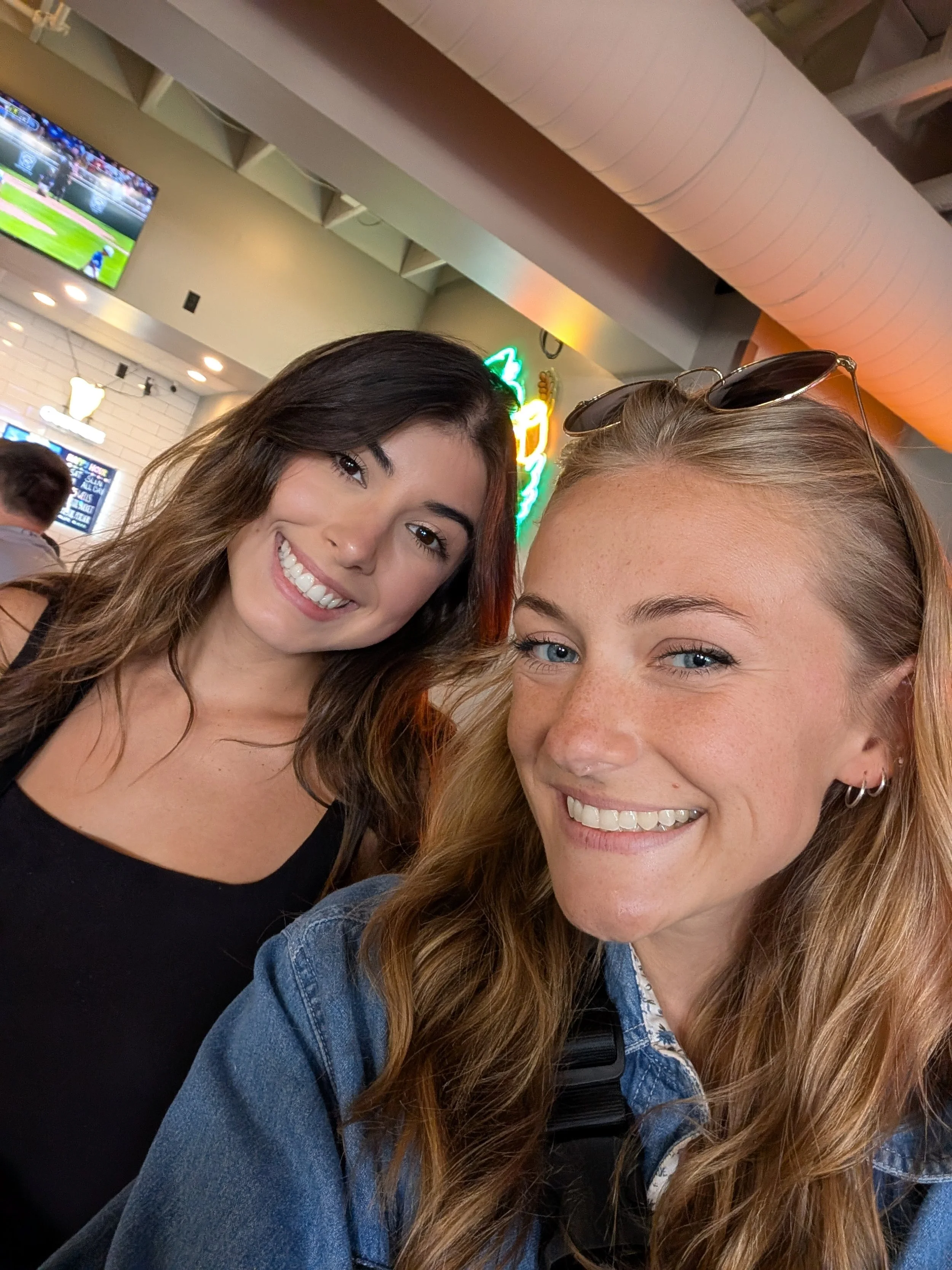 A selfie of two employees