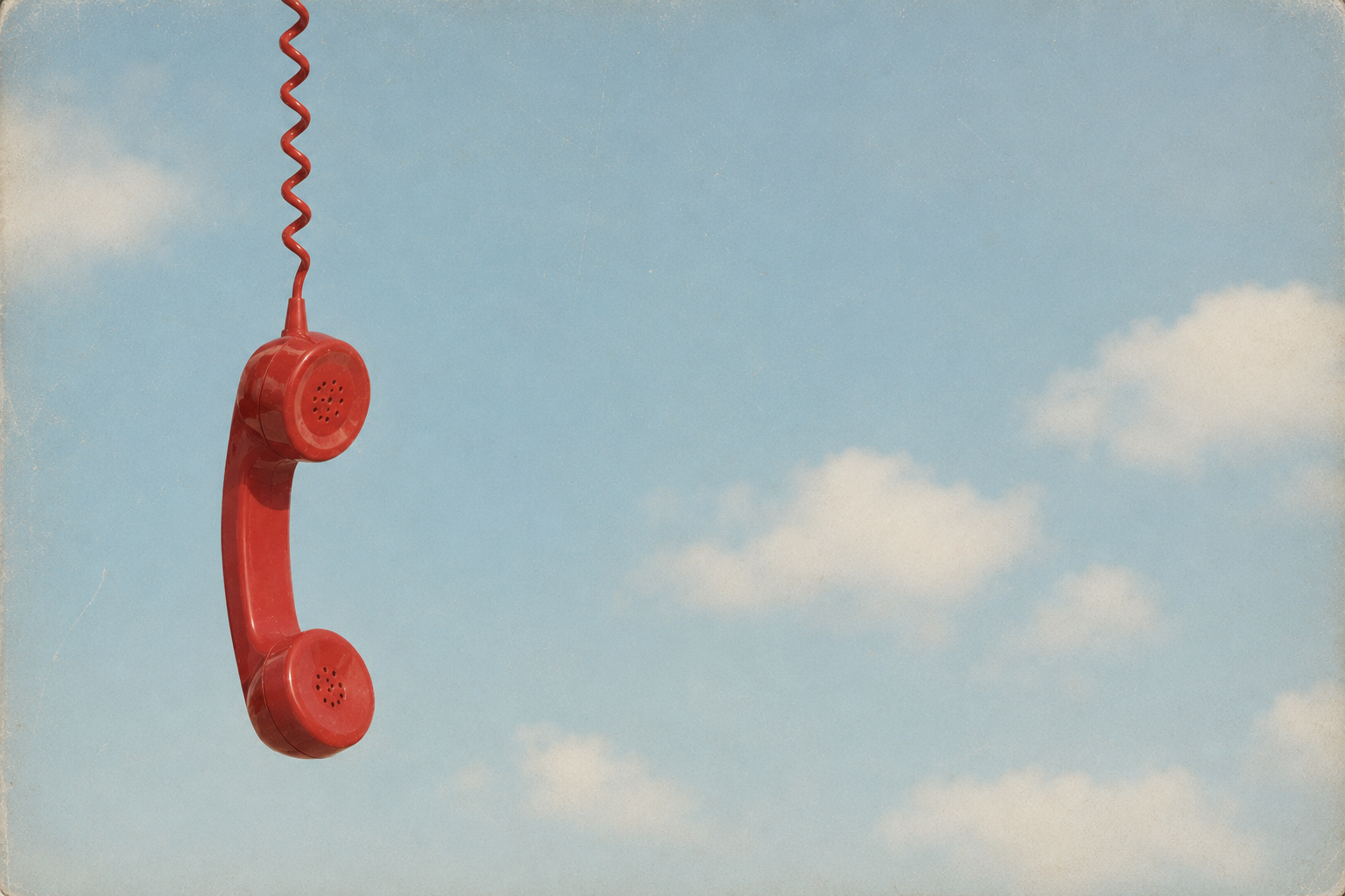 Vintage red phone receiver hanging by its cord against a blue sky, representing the reference check call before a final job offer