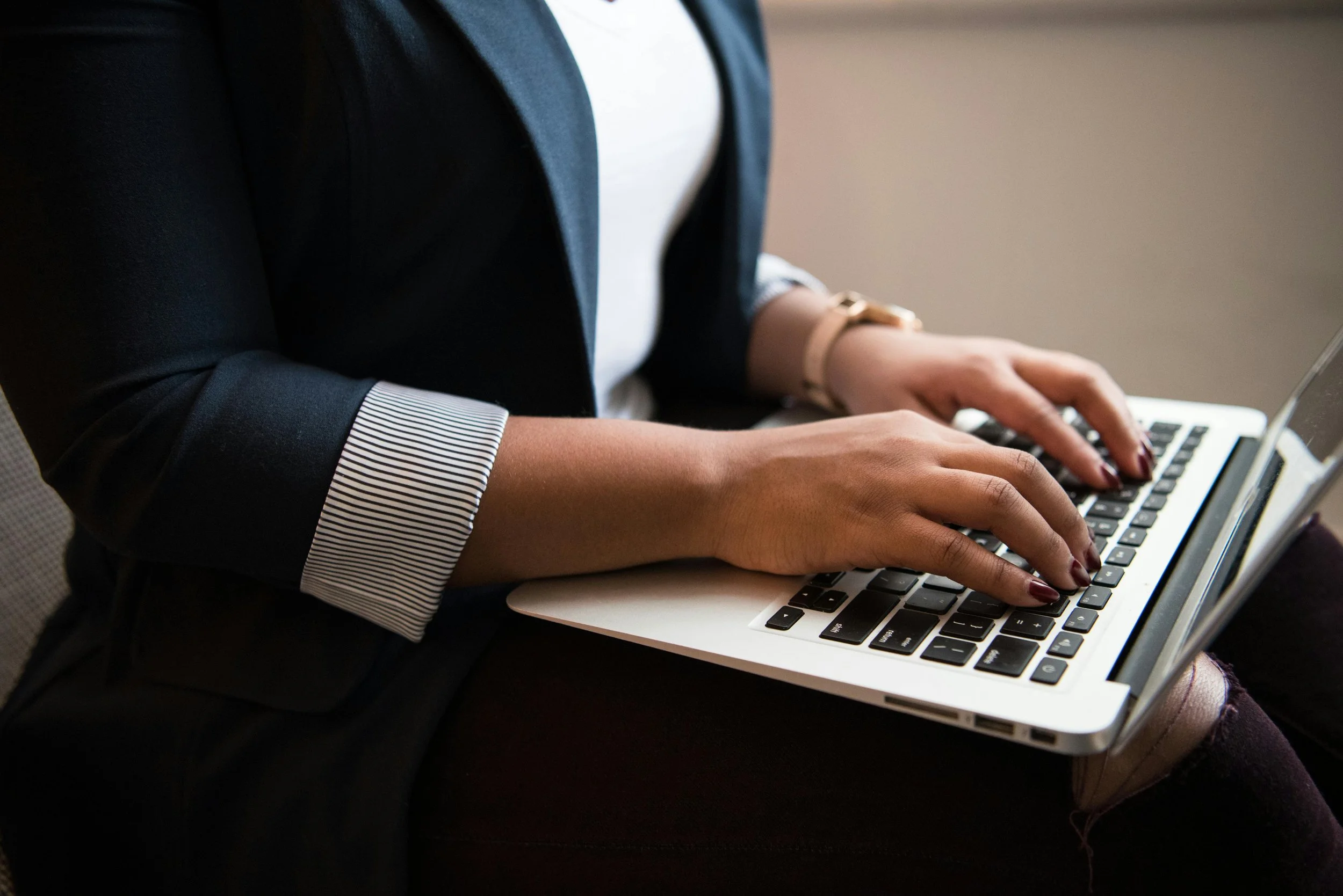 Woman typing on laptop