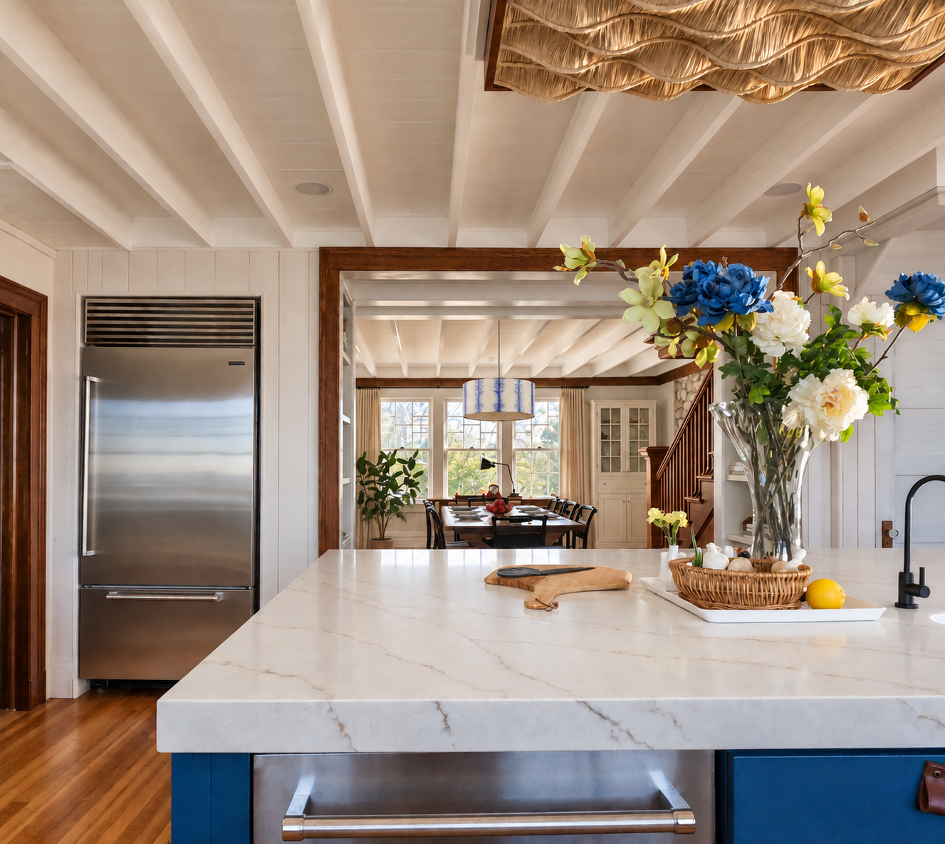 Shingle-and-Stone Kitchen & Dining Room with Panoramic Waterfront Views
This inviting kitchen and dining space in a beautifully crafted shingle-and-stone home is designed to celebrate its extraordinary surroundings. Expansive windows frame panoramic 