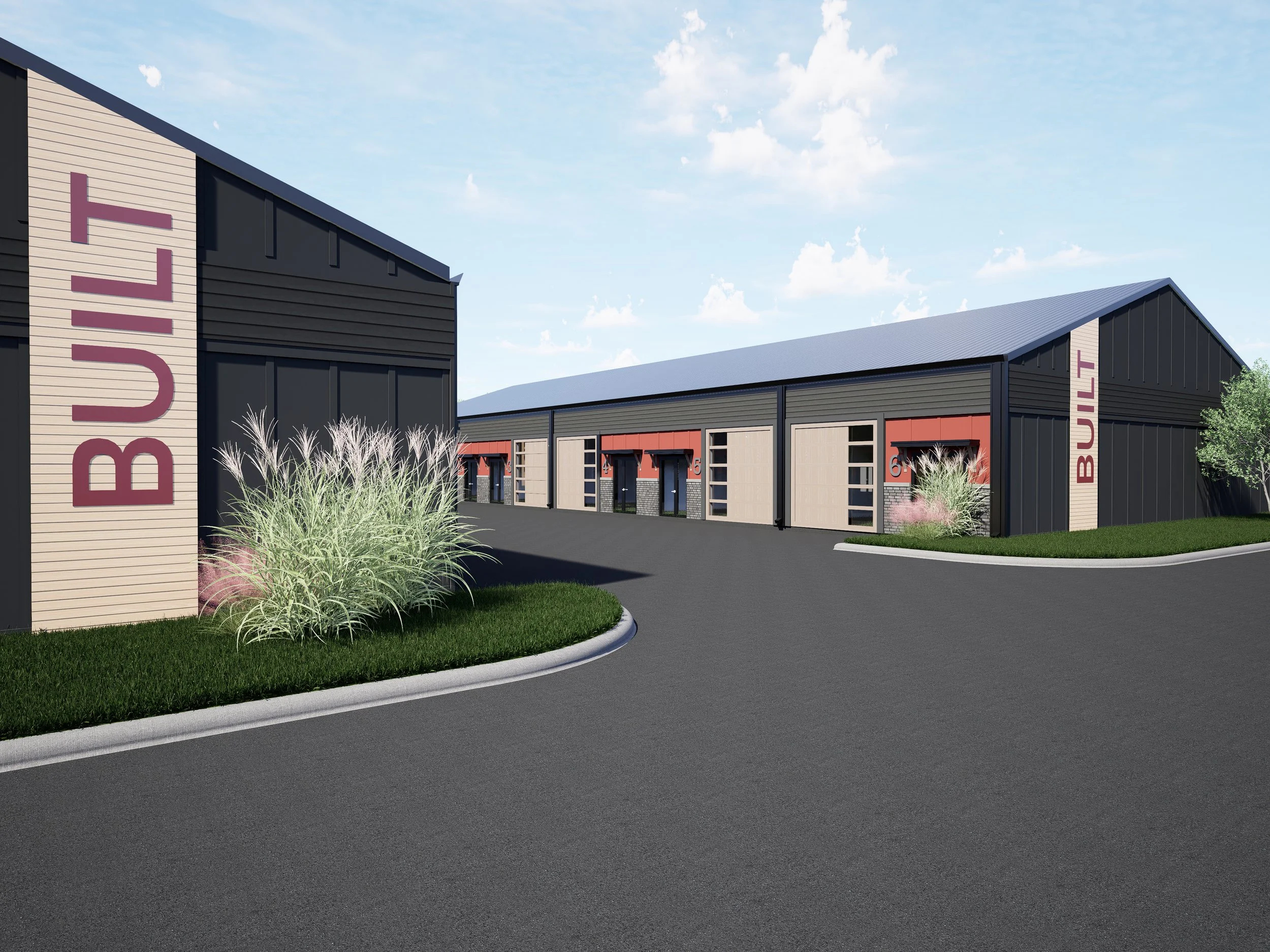 A modern warehouse or industrial building complex with black, beige, and red exterior walls, multiple garage doors, surrounded by landscaped greenery, under a partly cloudy sky.