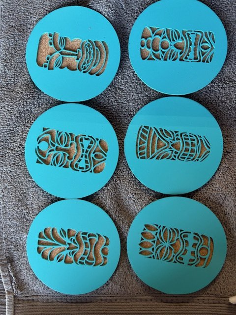 Six blue silicone molds with carved designs, each featuring Polynesian or tribal-style patterns.