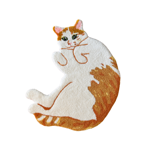 A plush rug shaped like a white and orange cat with green eyes, lying on its side.
