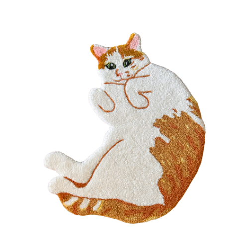 A plush rug in the shape of a white and orange cat with green eyes, sitting with one paw raised.