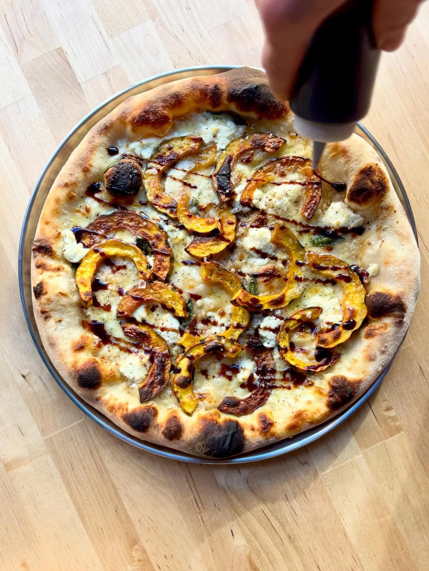New pie in Queen Anne! Meet the Delicata Queen⚜️ Delicata squash, leek cream, hand stretched mozzarella, saba dressing. 

🍯🍂👑

#squashpizza #delicatasquash #queenanneseattle #seattlepizza #seattlerestaurants