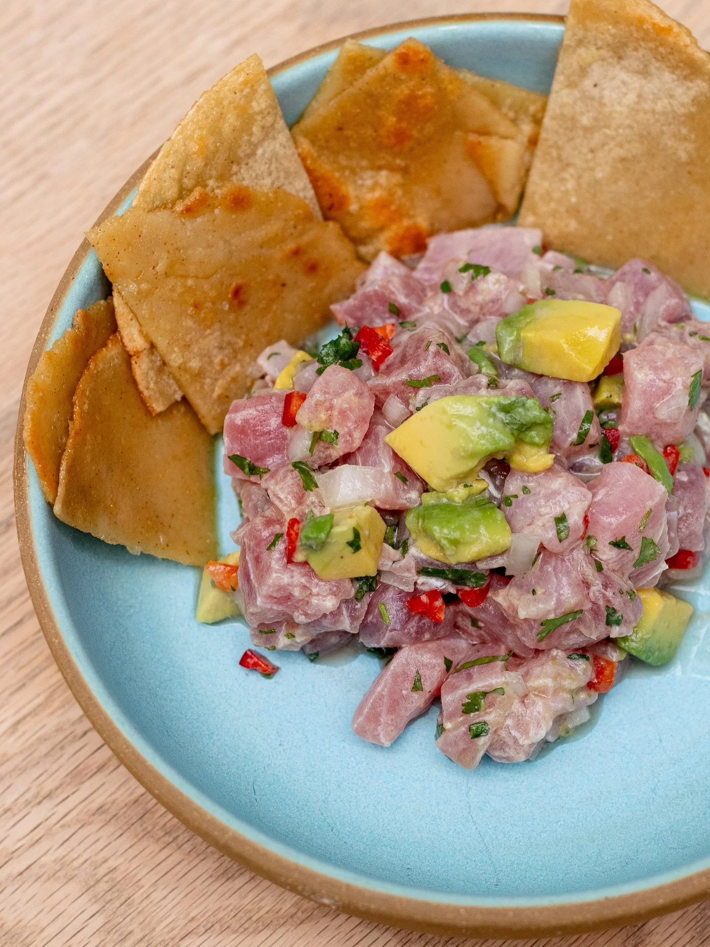 The Yellowfin Tuna Ceviche lands on the table with our house tortilla chips, which take a different path in life. We fry them in tallow and finish them in EVOO because seed oils are not part of the vocabulary here. The result is a chip that&rsquo;s s