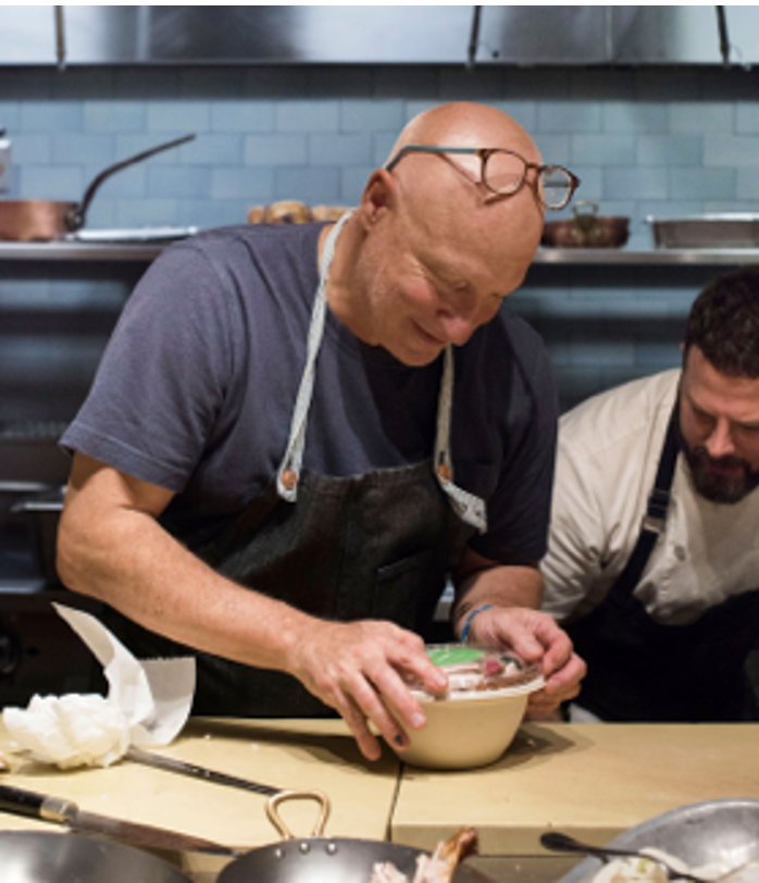 Tom Colicchio famous chef creating a custom salad with Bowery Farming indoor vertical farm hydroponic lettuce and salad greens. Event production by Laura Alyse Rubin.