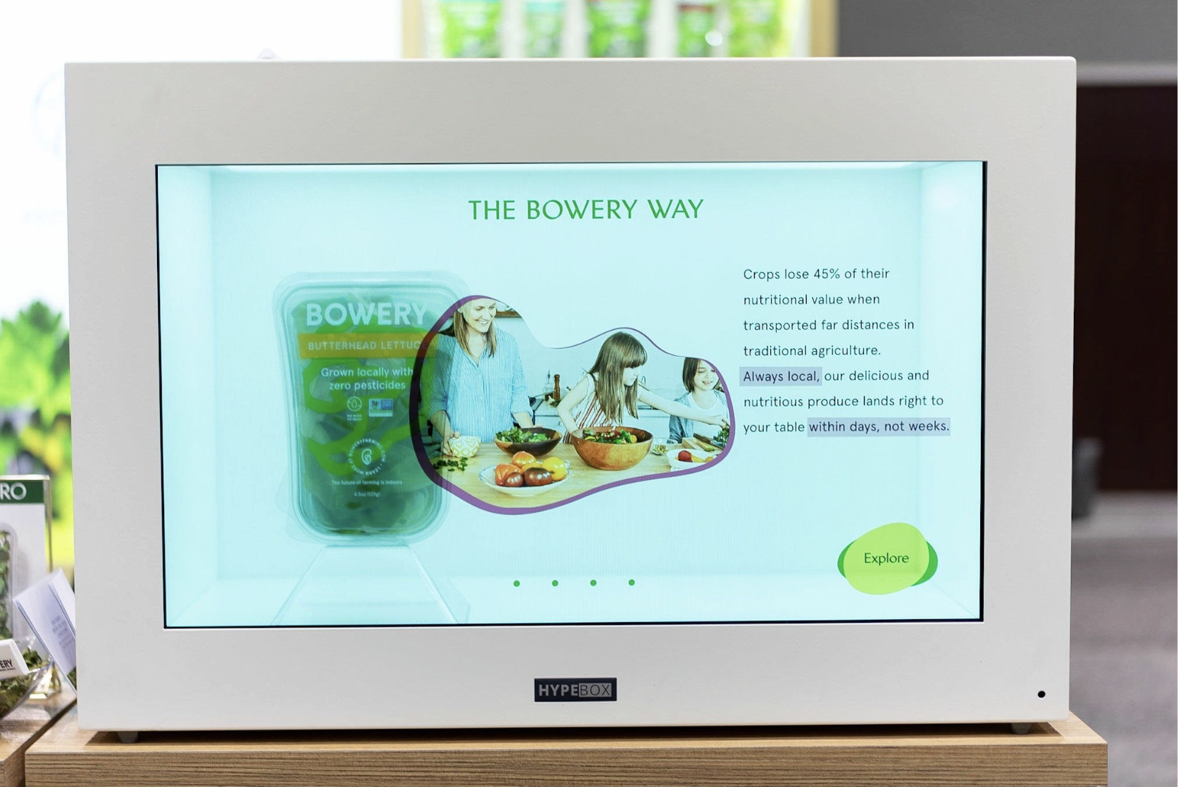 Trade show event production digital screen showing information about Bowery Farming, a company that grows lettuce locally without pesticides, emphasizing hydroponic indoor vertical farming. Laura Alyse Rubin marketing and event producer.