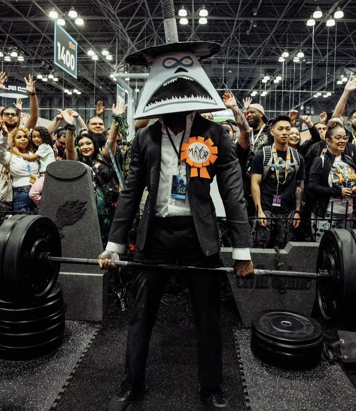 New York Comic Con 2024, a man wearing the Mayor costume from the Nightmare Before Christmas at the Civil Regime booth. Weightlifting competition. Event production and marketing by Laura Alyse Rubin.