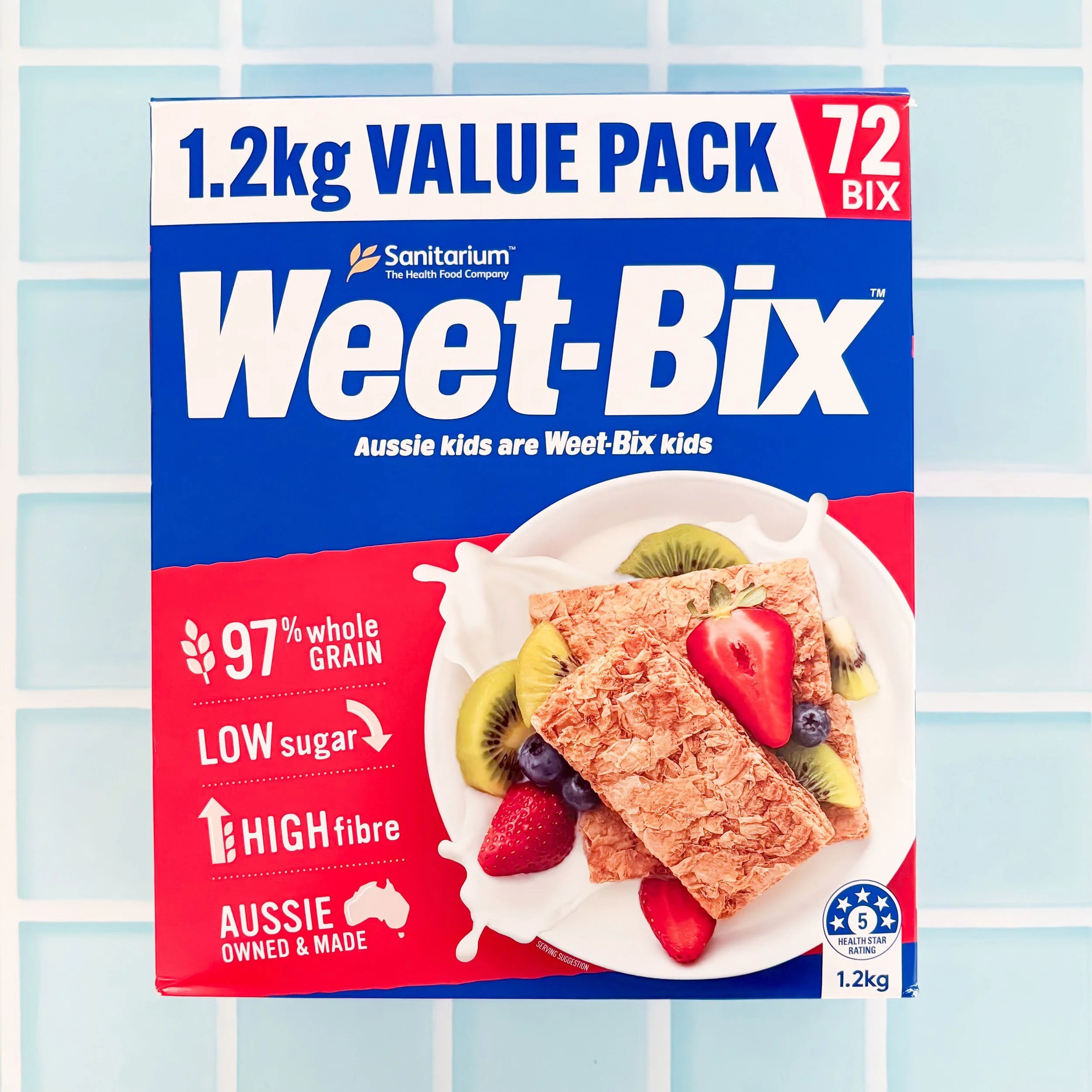Weet-Bix 1.2kg value pack box showing 5 health star rating, 97% whole grain, low sugar and high fibre claims on a blue tile background