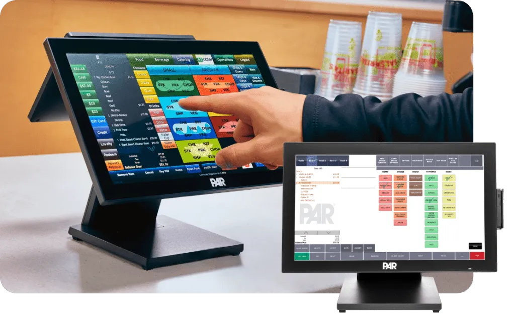 Point of sale touchscreen registers displaying order management screens at a restaurant or fast food establishment.