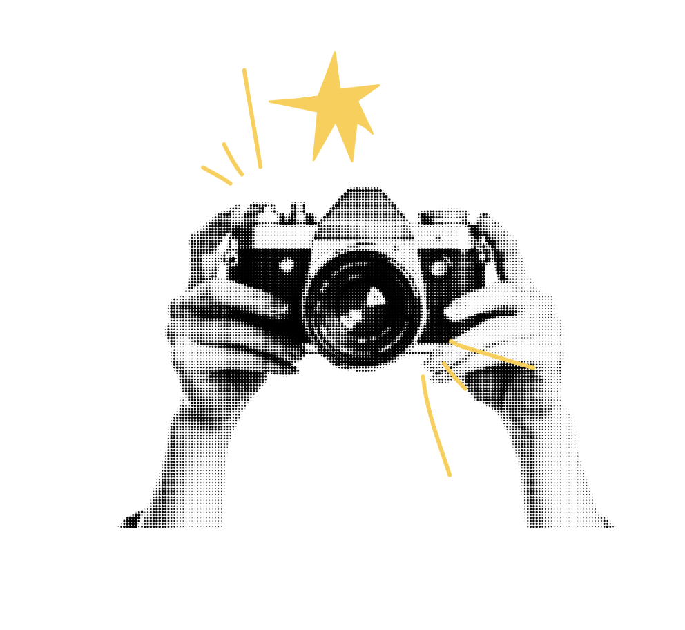 A person holding a camera with a star and lines drawn around it for emphasis.