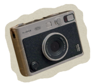 Photo of a Fujifilm Compact Instax camera with a black and beige design.