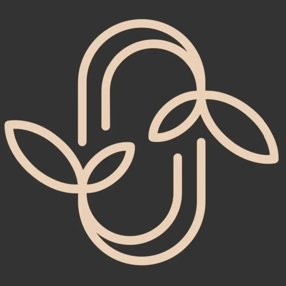 Minimalist line drawing of a paperclip with leaves, on a dark background.