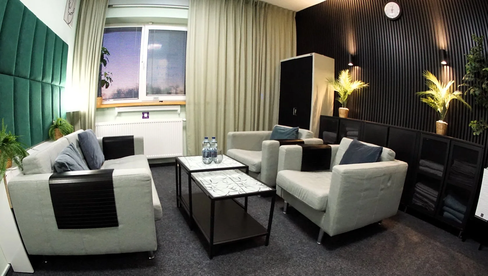 Green accent and soft lighting in the PsycheClinic office – peace and balance in therapy.