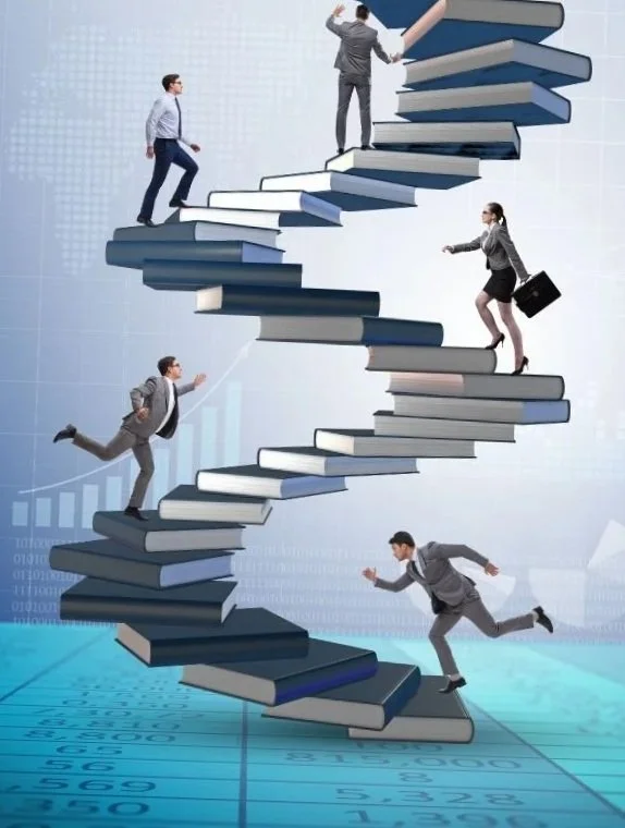 Businesspeople climbing a spiral staircase made of books, symbolizing progress in education or career.