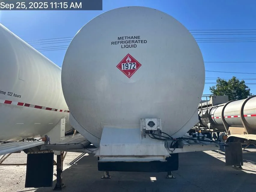 A large white tanker trailer labeled 'Methane Refrigerated Liquid' with a red hazard symbol indicating chemical hazard, parked outdoors under a blue sky. The timestamp in the image indicates it was taken on September 25, 2025, at 11:15 AM.