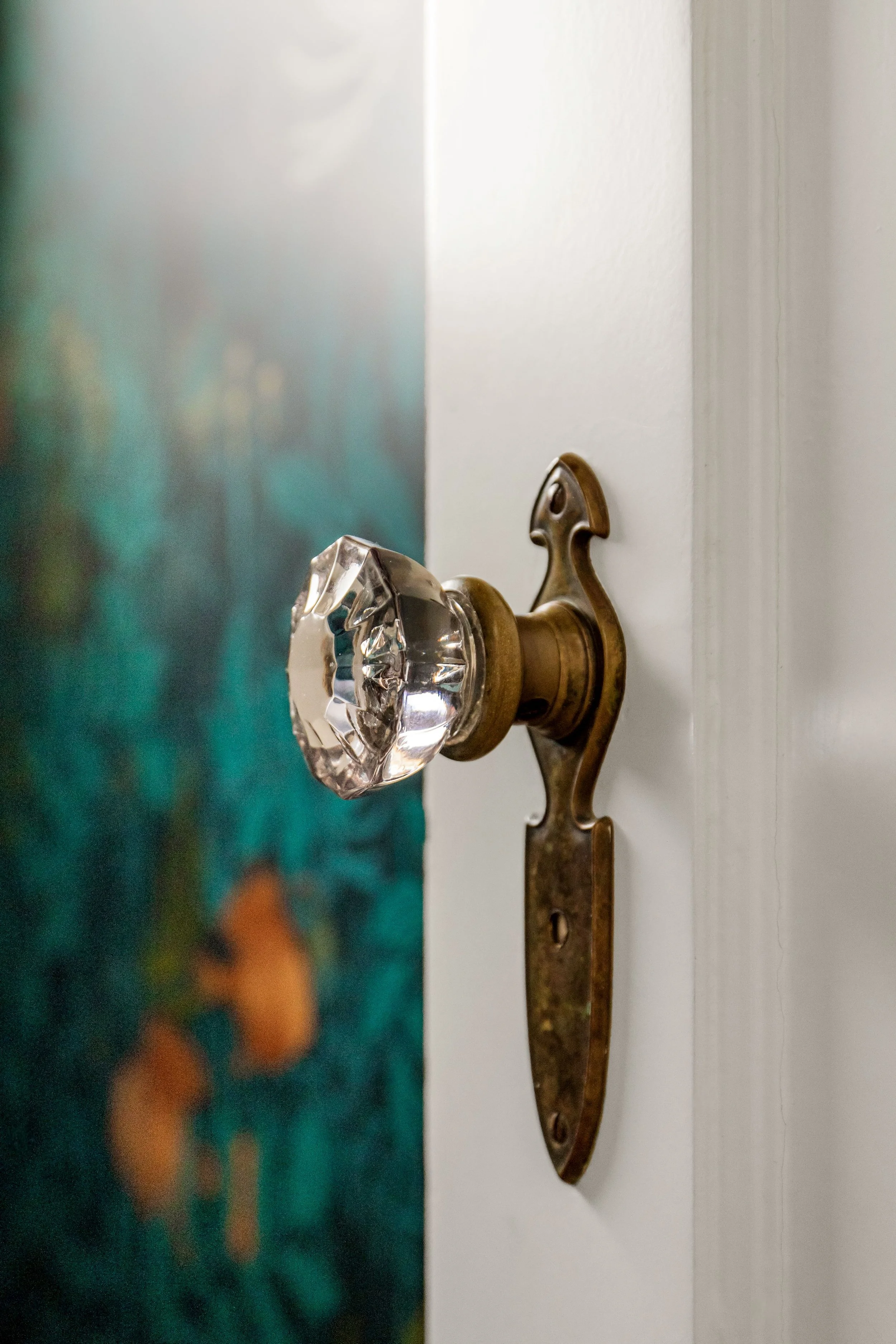 Vintage crystal door knob detail in Alameda powder room by Design With Refinement Portland