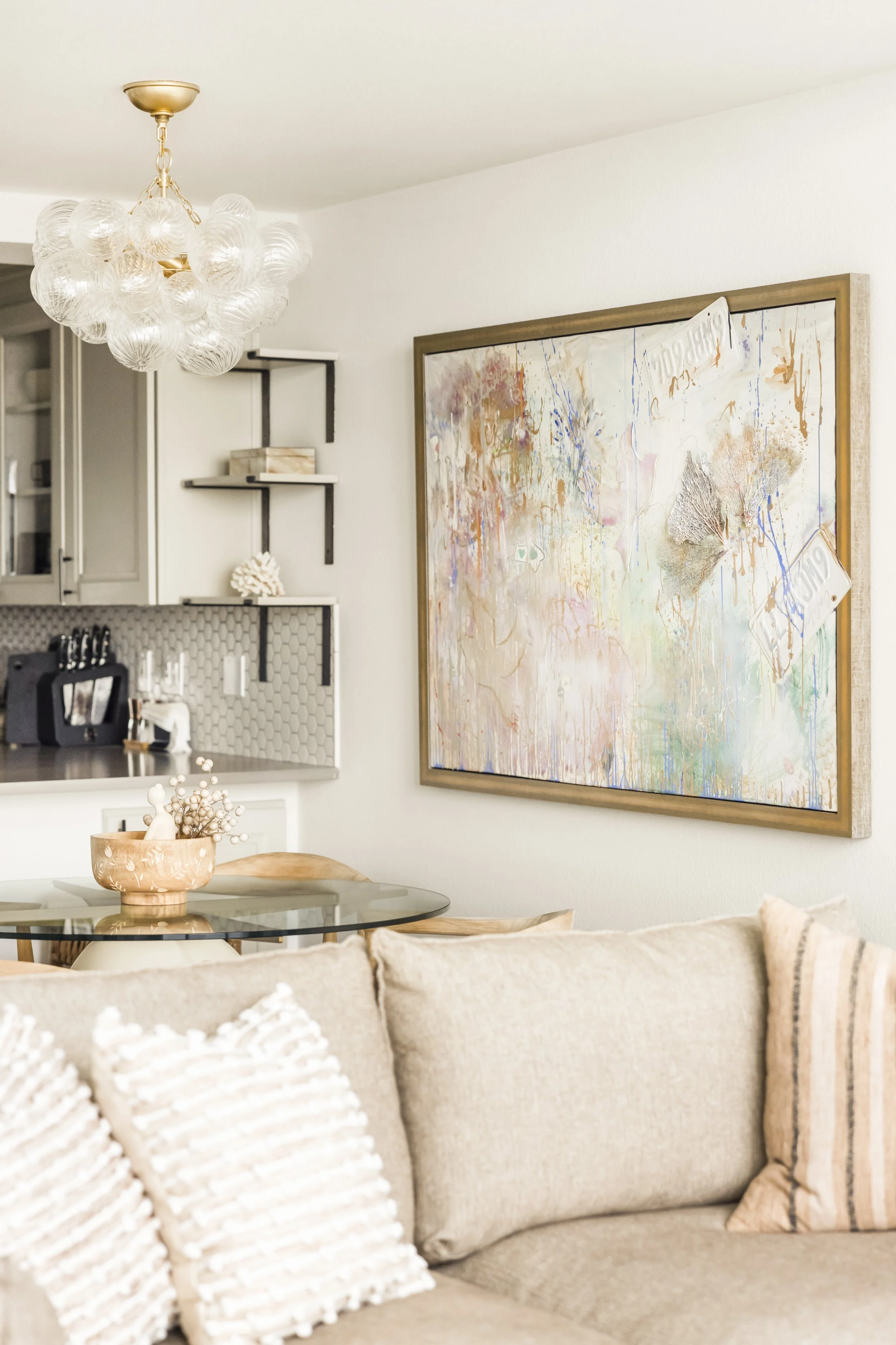 view from sofa to dining room with bubble chandelier