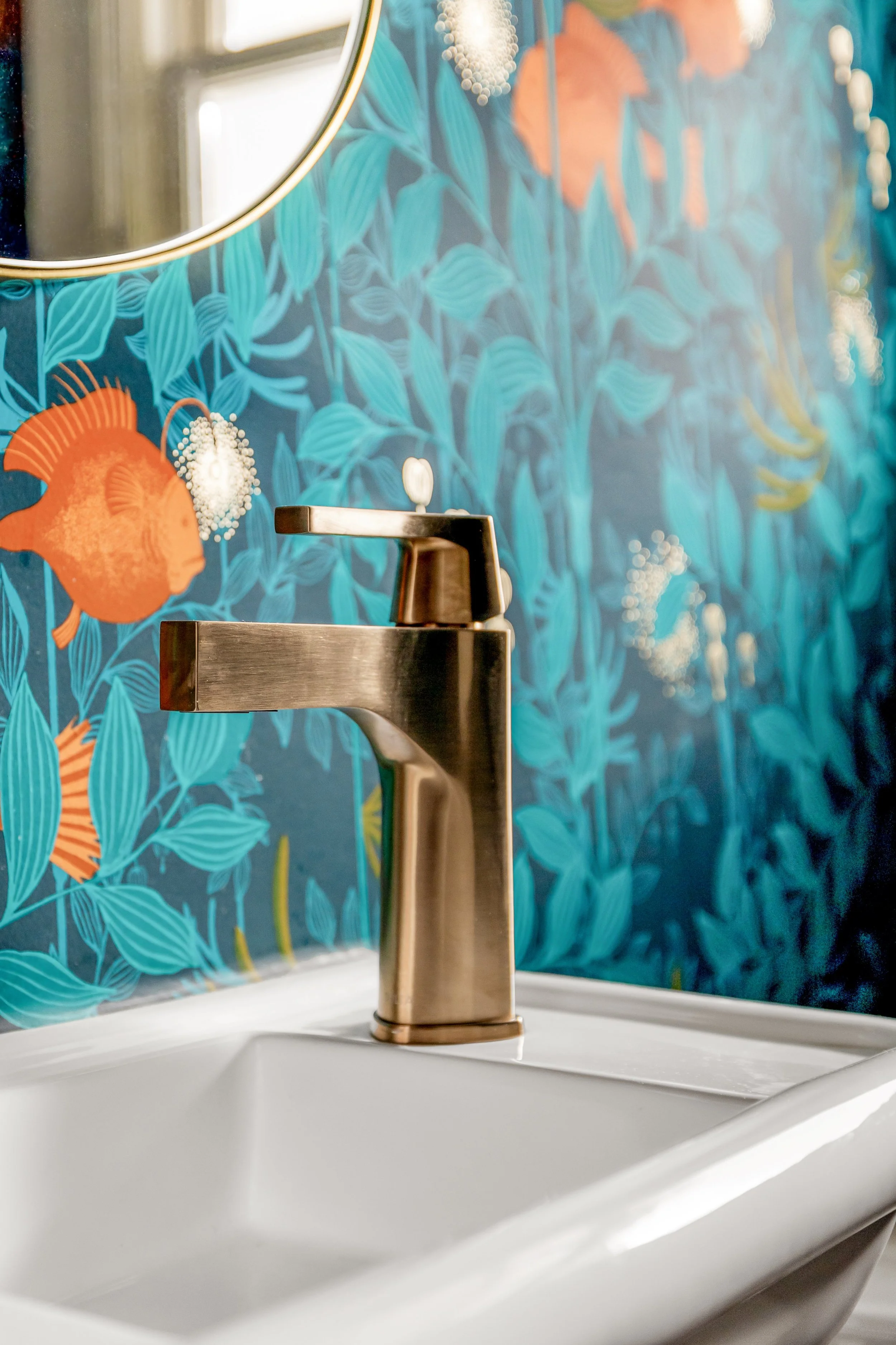 Brass faucet detail in Alameda powder room remodel by Design With Refinement Portland interior designer