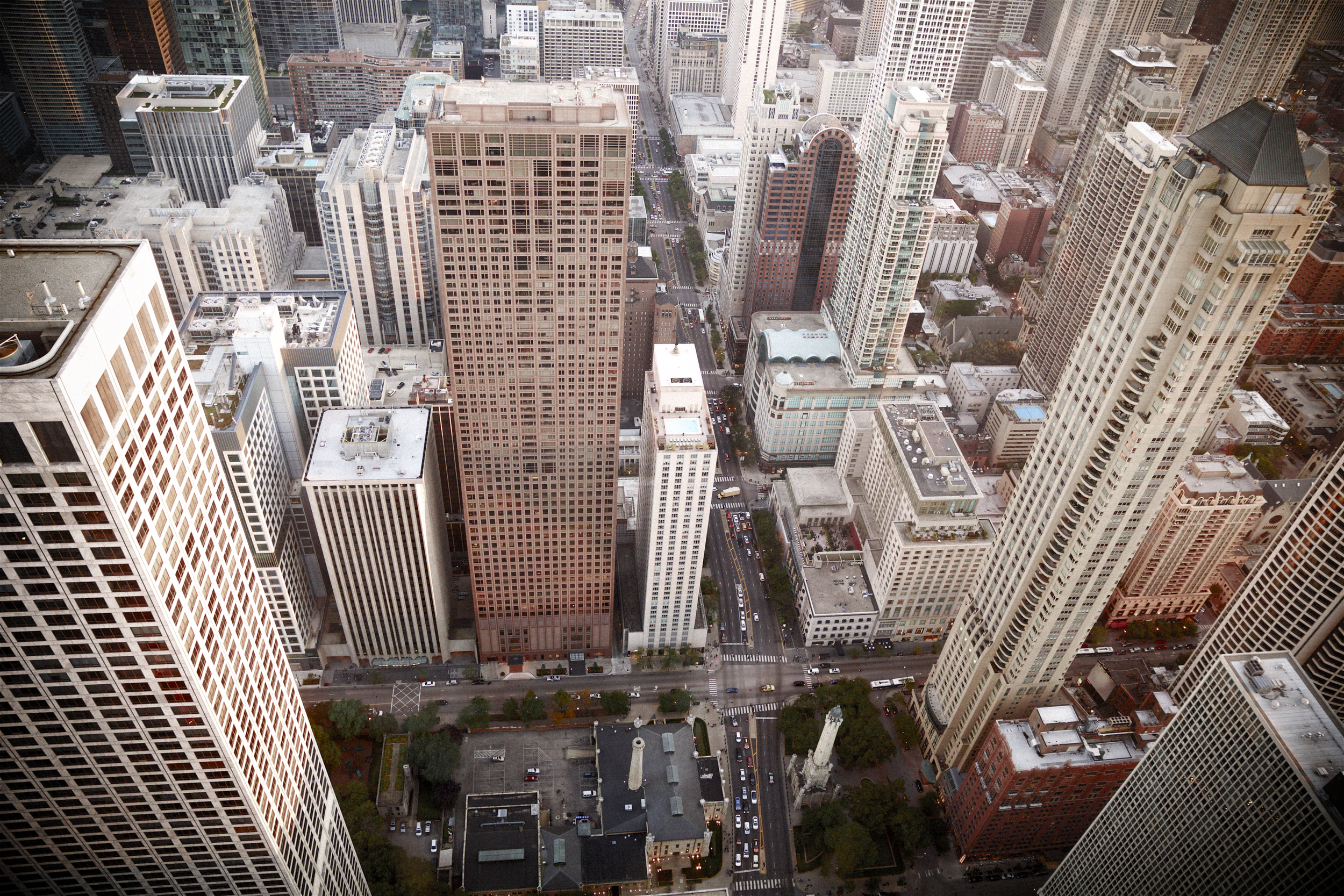 Aerial view of central Chicago’s urban fabric, capturing the density, vertical scale, and structural complexity that shape real estate strategy across the region.