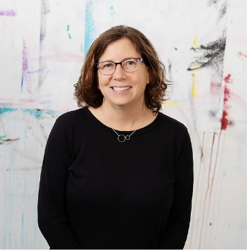 brown haired woman with glasses