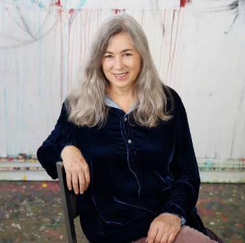 picture of a woman with gray hair sitting in a chair