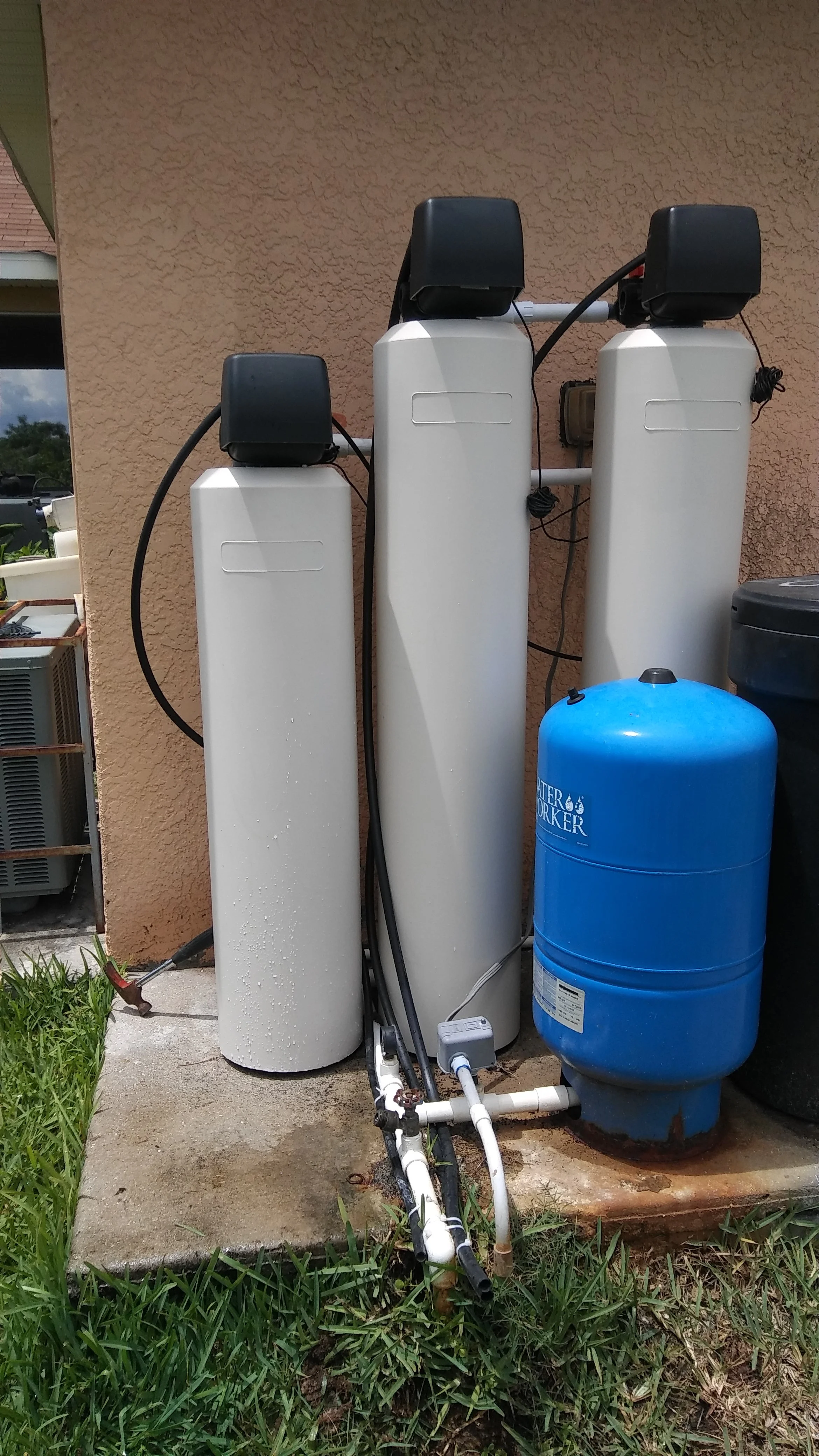 Southwest Florida well water system with aeration, sulfur and iron filters, and softener to remove rotten egg smell, sulfur odor, iron stains, hardness, bacteria, and discoloration. RO for drinking water.