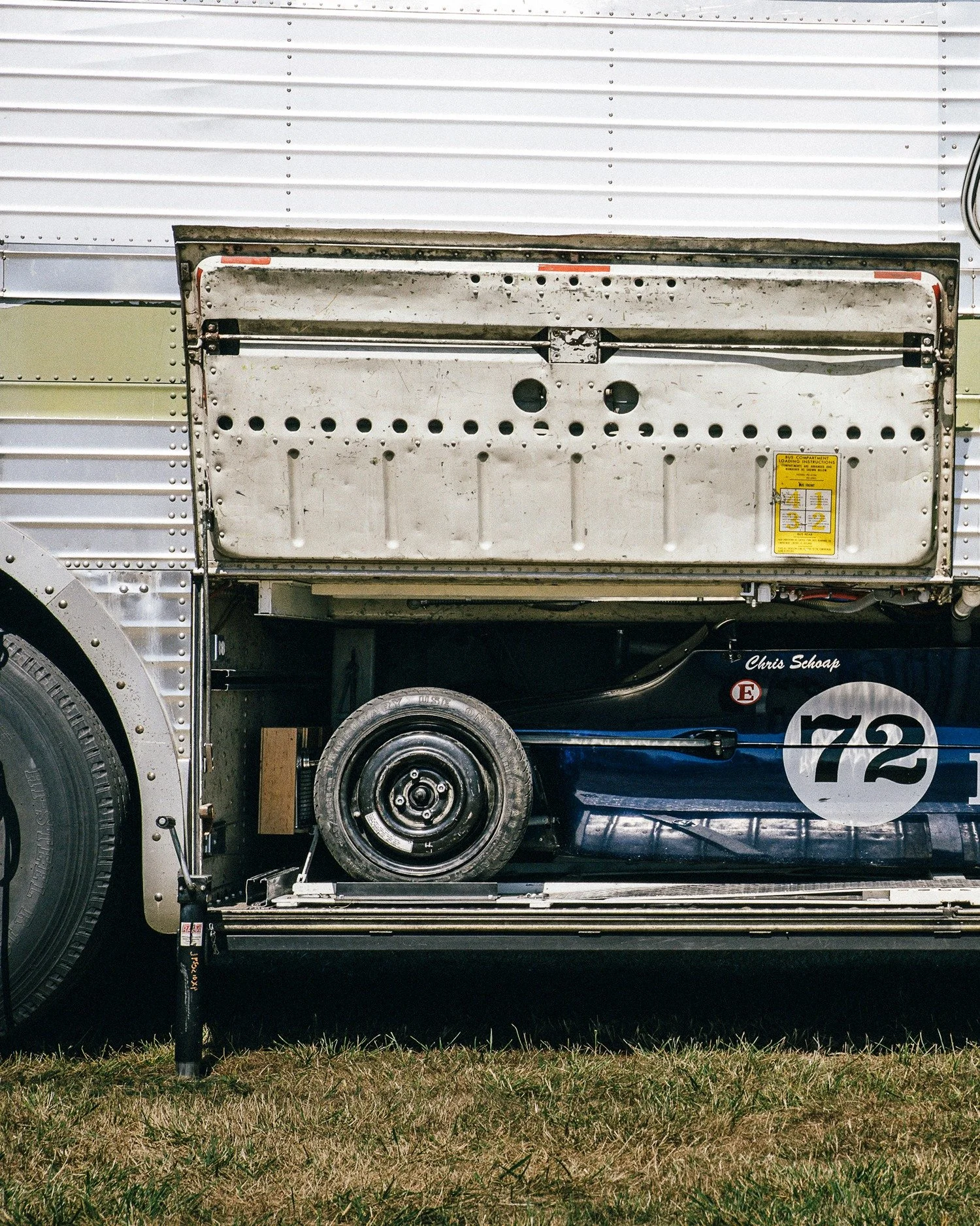 No. 72
Photograph by @aaronwmckenzie
Date: 2021
📍Portland International Raceway

Racer Chris Schoap converted an old Greyhound bus to accommodate his Formula Ford in the luggage compartment. Voil&agrave;! Motor home and car hauler in one tidy but gi