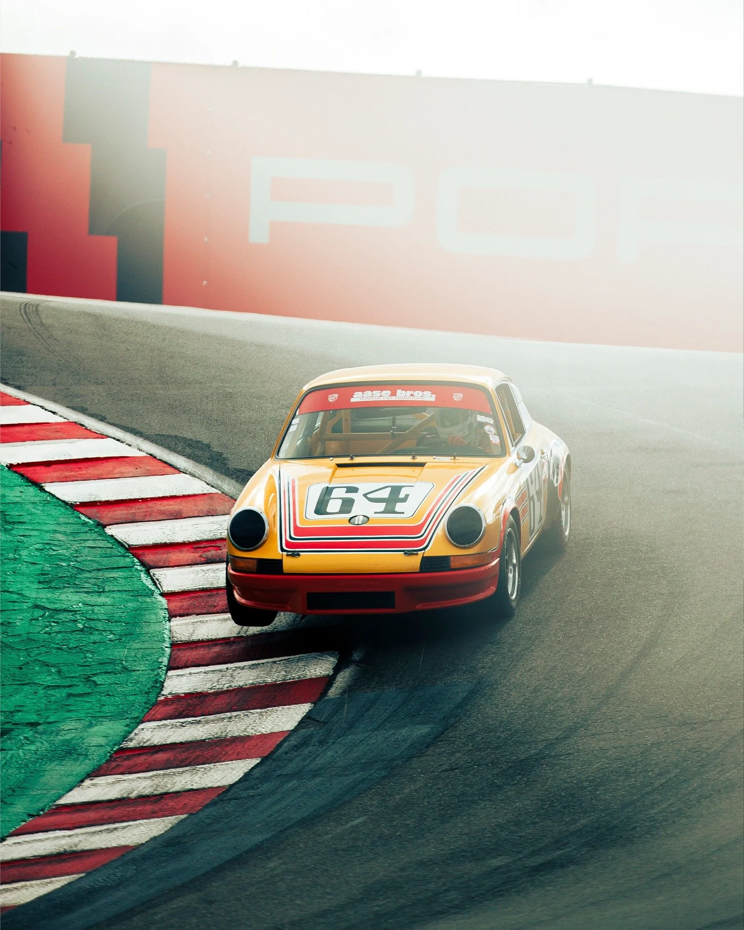 No. 64
Photograph by @thvddeus 
Date: 2023
📍WeatherTech Raceway Laguna Seca

James describes this gorgeous shot of a 1966 Porsche 911 S three-wheeling into the Corkscrew at Laguna Seca during Rennsport Reunion 7 as the moment the car &ldquo;becomes 