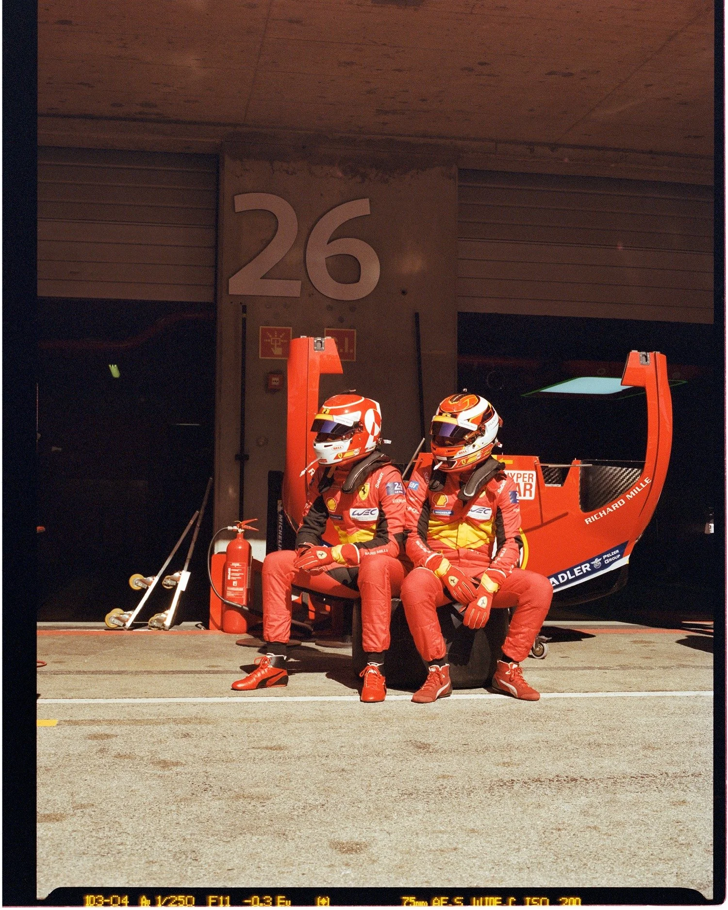 No. 26
Photograph by @vinceperraud 
Date: 2023
📍Algarve Inter&shy;national Circuit

In 2023, Perraud followed the World Endurance Championship, shooting behind-the-scenes moments on film. Here he caught Ferrari 499P drivers Nicklas Nielsen and Anton