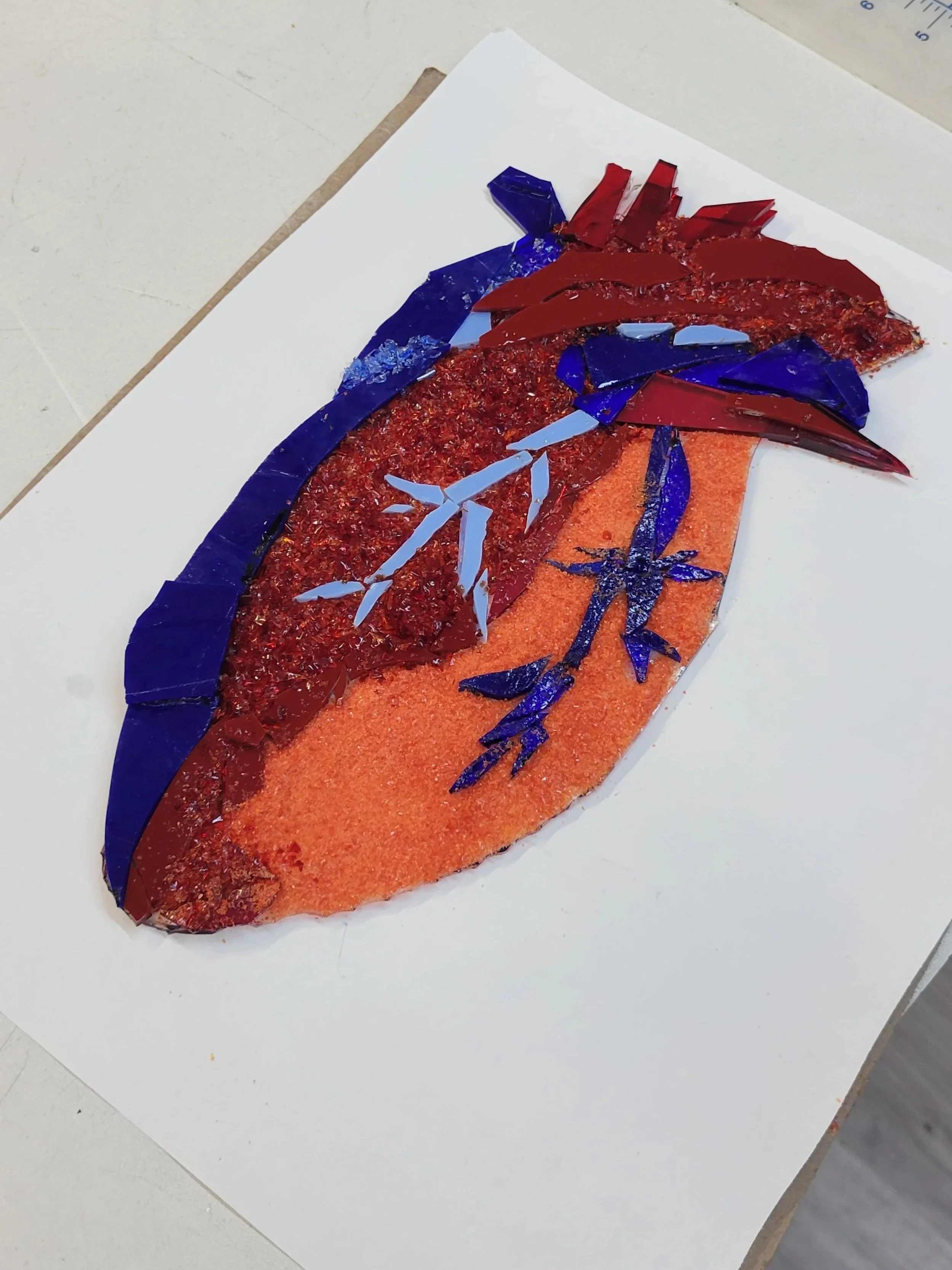 The preview before it was put in the kilm for a Contour fuse or tack fuse. The temperature range is around 1350 to 1375 degrees. This type of fusing is great for texture and layered look. 