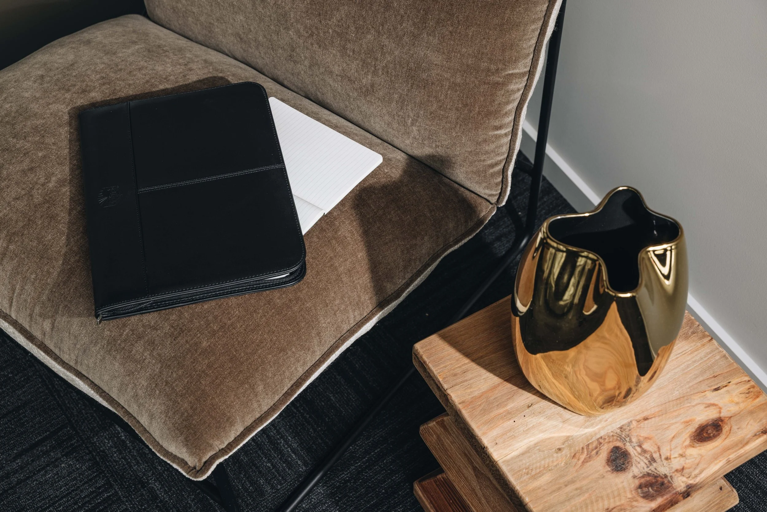 Client notes and notepad on couch