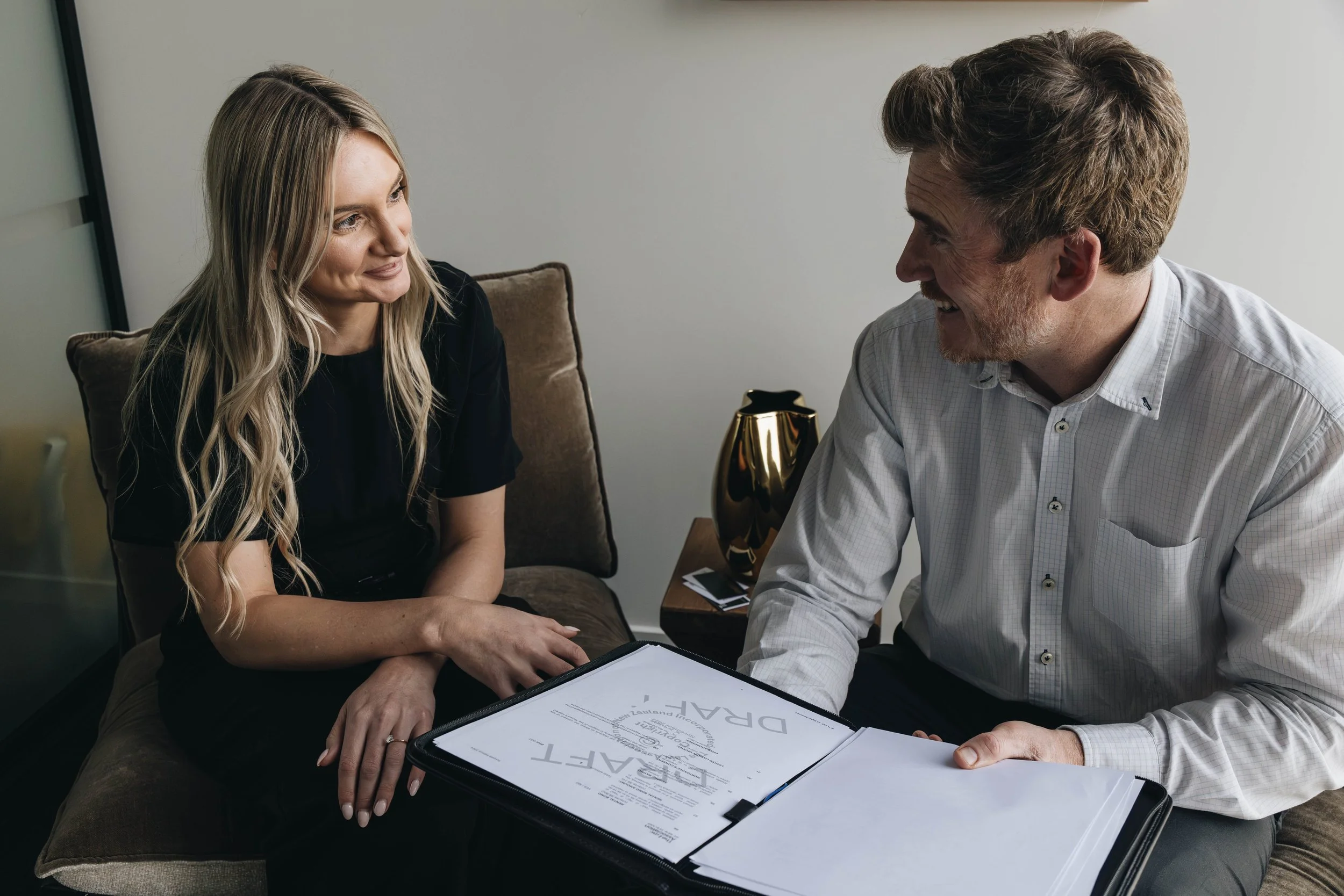 Two people going over a legal document