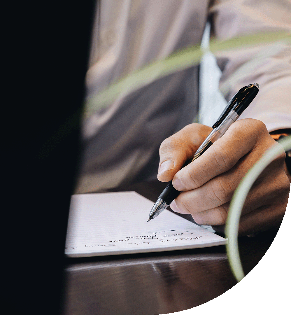 Person taking notes at meeting